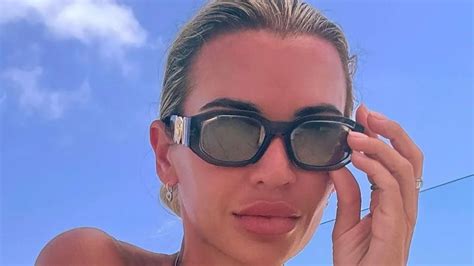 Christine McGuinness sets pulses racing as she sunbathes。